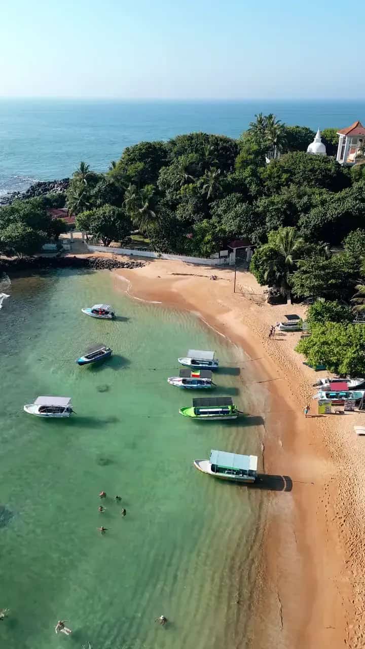 Bay with boats on the south coast from the air