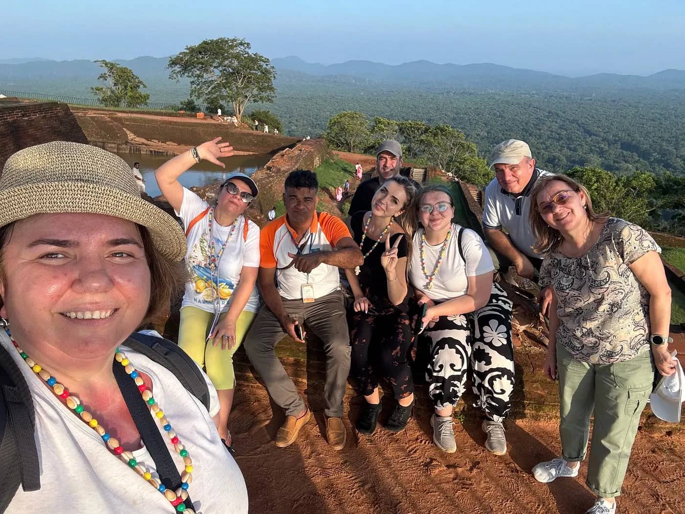 Sri Lanka tour with a guide: guests with our team on top of Sigiriya Lion Rock
